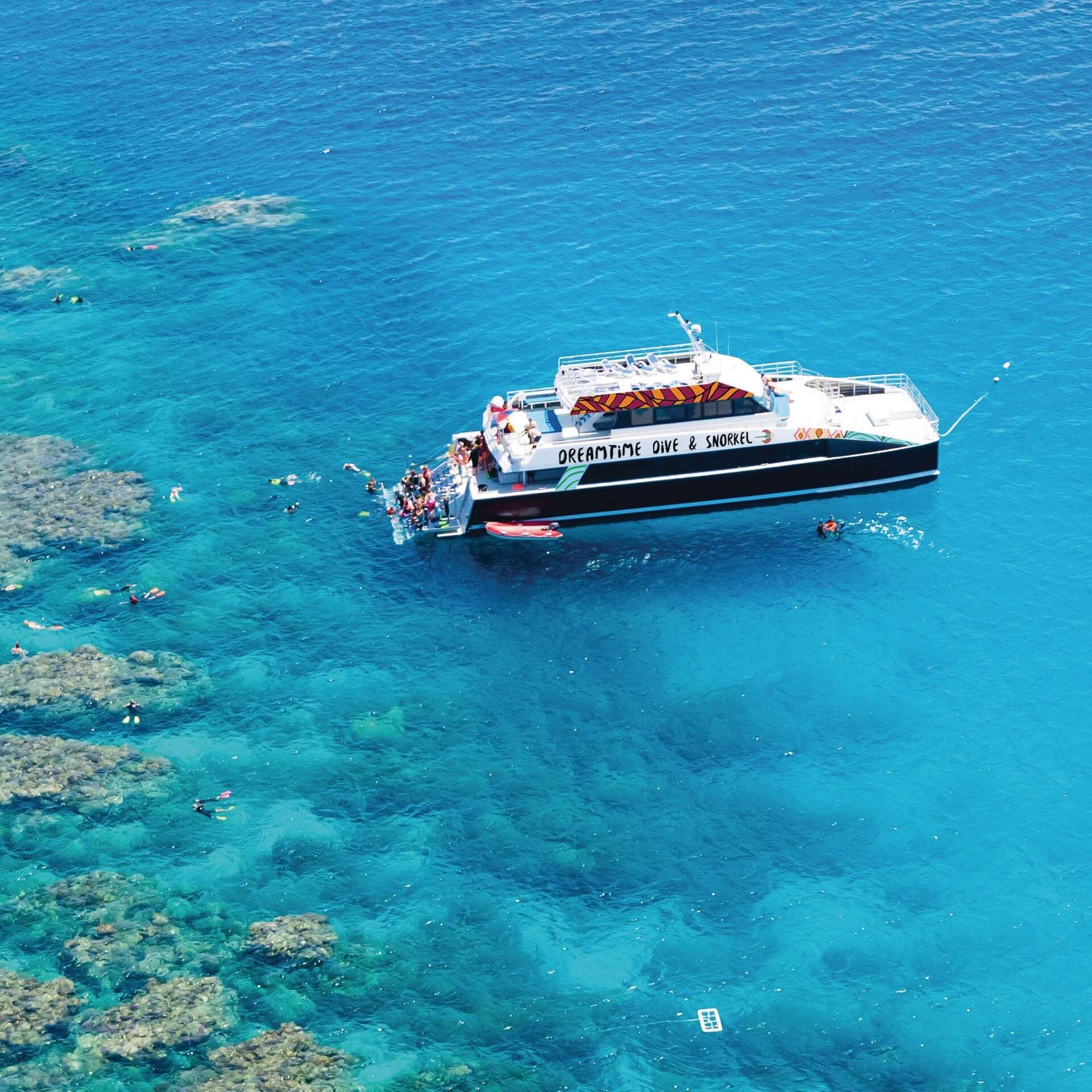 Aerial of divers and boat on Dreamtime Dive and Snorkel, Great Barrier Reef, Queensland © Tourism and Events Queensland