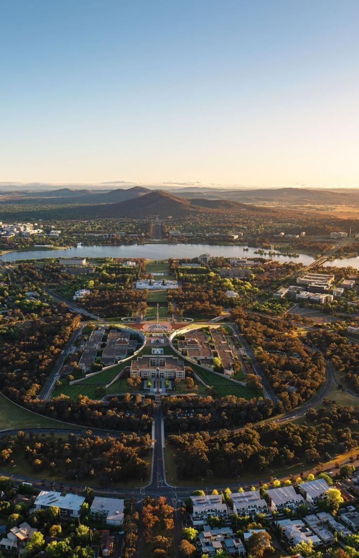 Aerial view over parliament house and Lake Burley Griffin in Canberra, Australian Capital Territory © Tourism Australia