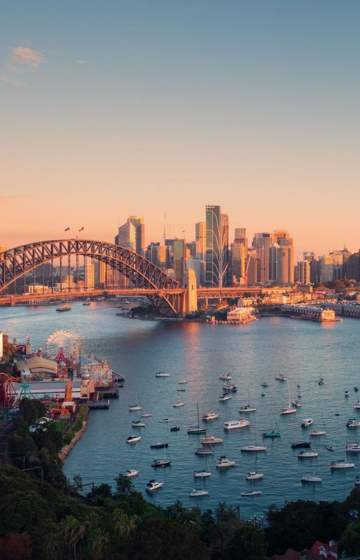 Sun rising over Sydney Harbour and Circular Quay, Sydney, New South Wales © Destination NSW