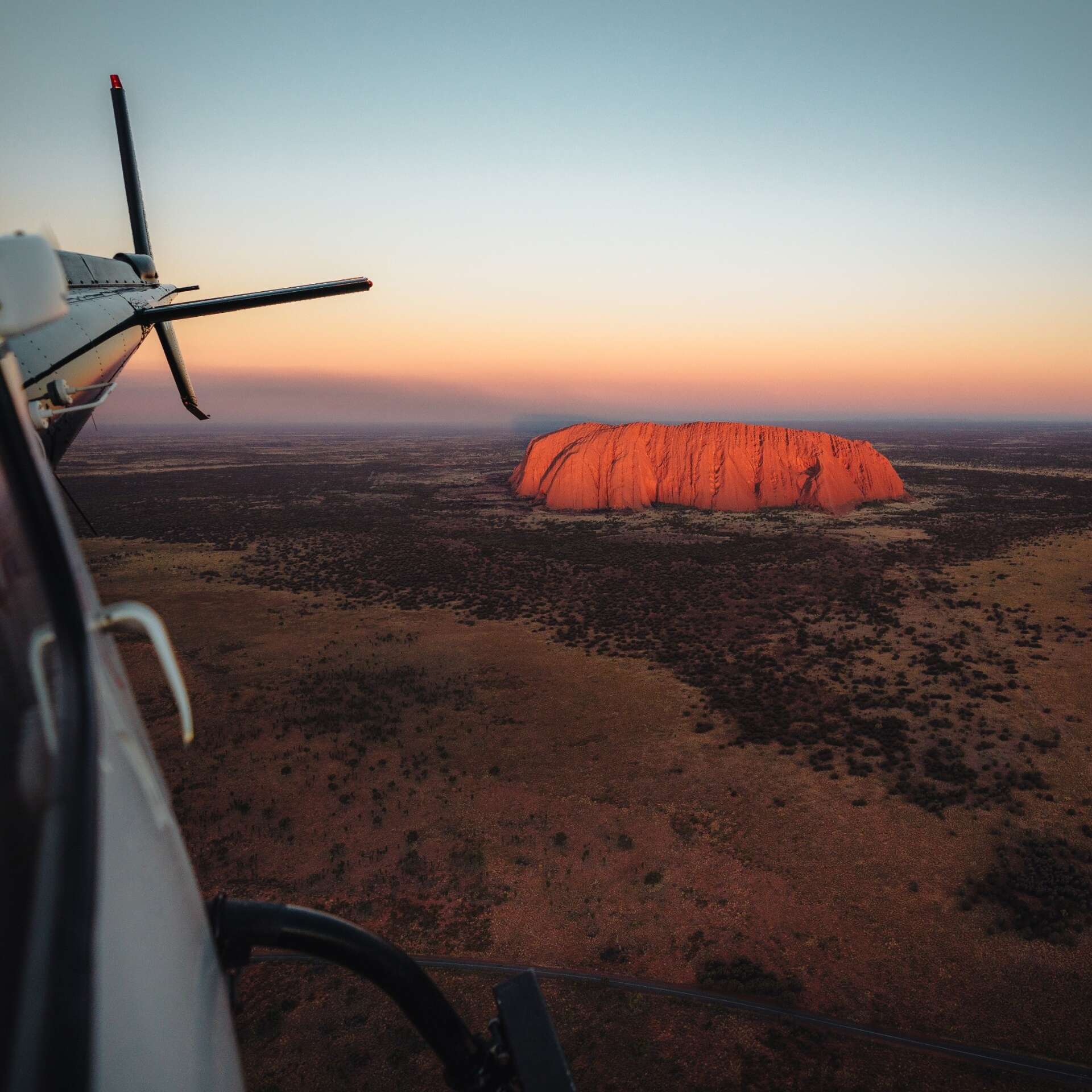 Uluru helicopter tour at sunrise, Uluru-Kata Tjuta National Park, Northern Territory © Tourism NT, Jason Charles Hill