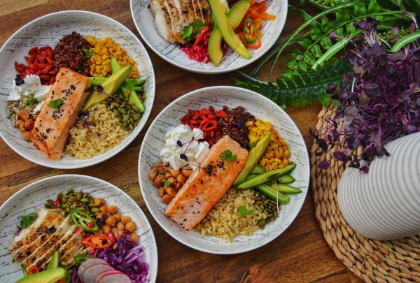 Fresh, colourful nourish bowls topped with seared salmon, grilled chicken, grains, and avocado highlight event dining at Gold Coast Convention and Exhibition Centre, Gold Coast, Queensland. © Gold Coast Convention and Exhibition Centre