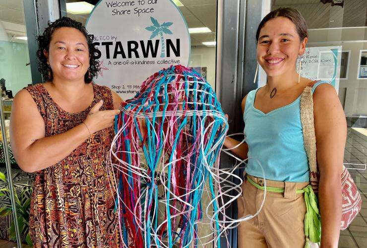 Two women holding up artwork at the 'Turn marine debris into art' workshop in Darwin, Northern Territory © MK Eco by Starwin