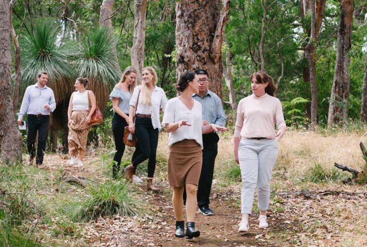 Group of people walking through the bush, participating in the Margaret River Wine and Wildlife Tour in the Margaret River region, Western Australia © Business Events Perth