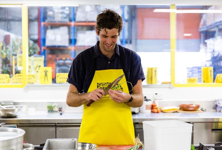 Man preparing meal at OzHarvest in Adelaide, South Australia © OzHarvest