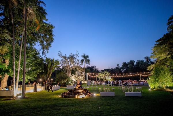 An evening outdoor event set on a lush lawn under fairy lights at George Brown Darwin Botanic Gardens, Darwin, Northern Territory. © Joseph 'JOEY' McGee