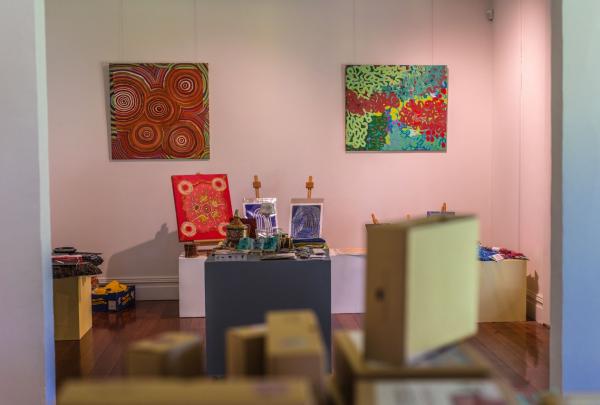 Vibrant Aboriginal paintings and cultural displays adorn light-filled gallery walls and timber floors inside Maalinup Gallery at Mandoon Estate, located in Caversham, Western Australia. © Maalinup Gallery