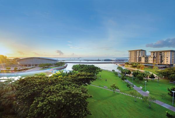 Vast aerial view of lush green parklands and waterfront surrounding the modern complex at Darwin Convention Centre in Darwin, Northern Territory. © Darwin Convention Centre