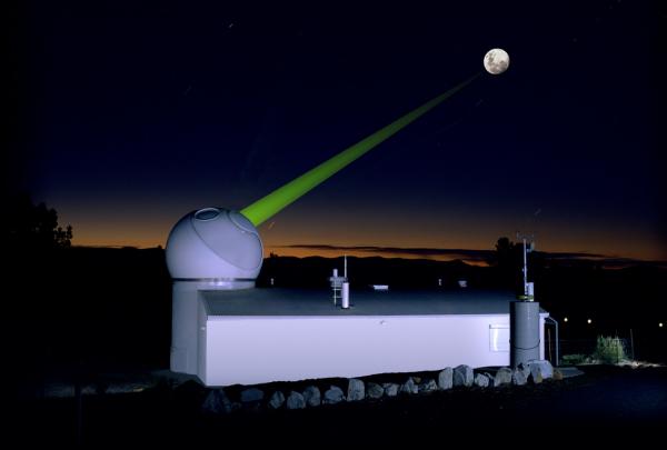 A green laser beam shoots into the night sky towards the moon from a dome observatory building at The EOS satellite laser ranging facility at Mount Stromlo, Australian Capital Territory. © EOS Space Systems