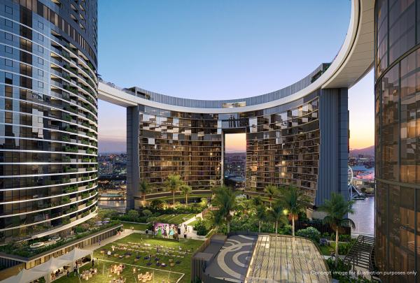 A curved Sky Deck offering panoramic views high above the lush green outdoor spaces of Queen's Wharf Brisbane, Brisbane, Queensland, framed by sleek modern skyscrapers under a warm twilight sky. © Queen's Wharf Brisbane