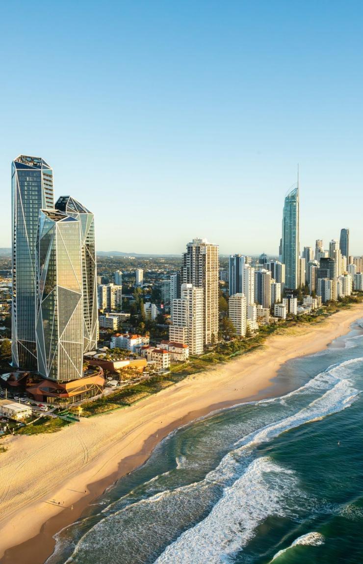 An aerial view over Surfers Paradise Beach captures a lively scene under bright sunshine, Gold Coast, Queensland © Tourism Australia An aerial view over Surfers Paradise Beach captures a lively scene under bright sunshine, Gold Coast, Queensland © Tourism Australia