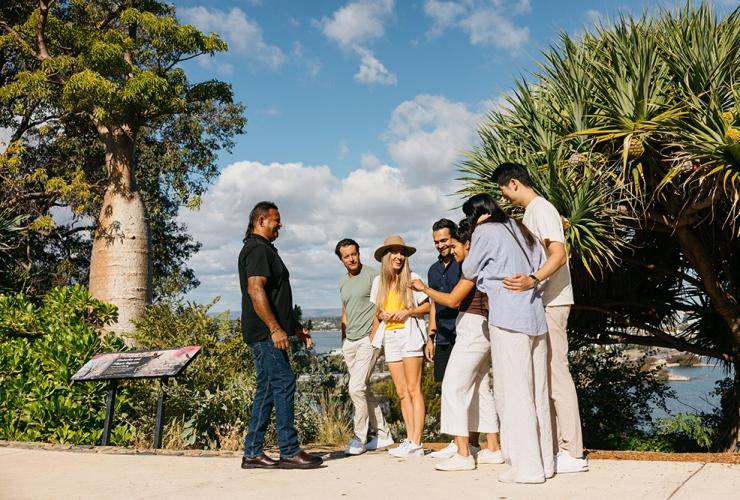 A tour guide from In Culture Tours, an indigenous tour company in Perth, leads a group through Kings Park, Perth, Western Australia © Tourism Australia