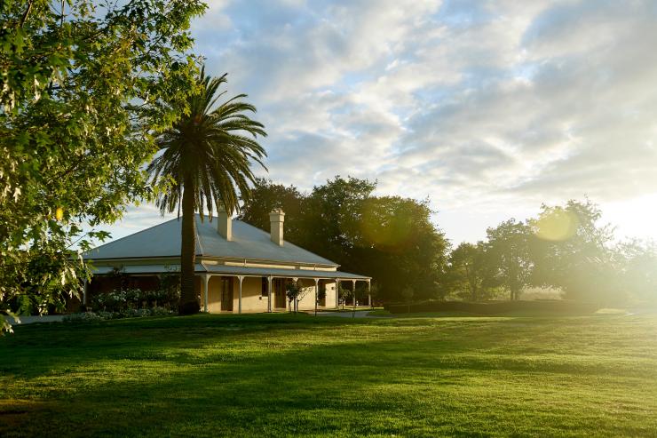 A side on view of The Chandon Homestead and the expansive lawn, Yarra Valley, Victoria © Chandon Homestead / Earl Carter Photography