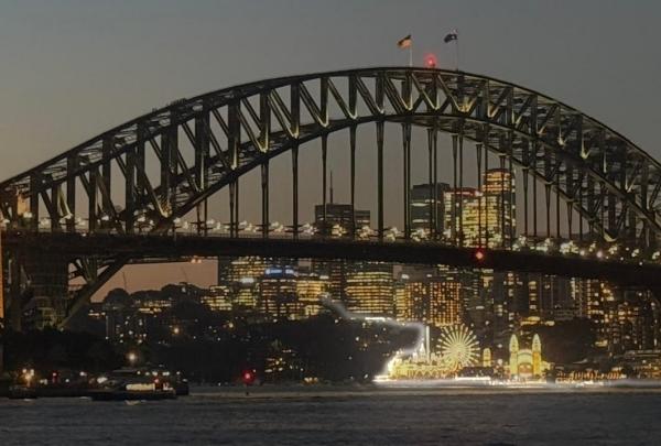 A view of Sydney Harbour Bridge lit up at night © Judi Froehlich