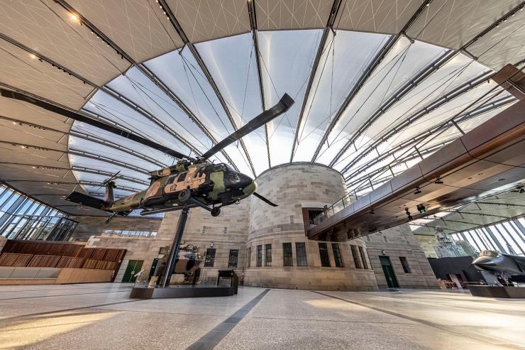 View of the Atrium showing the helicopter, fighter jet and tank under the expansive glazed roof © Australian War Memorial