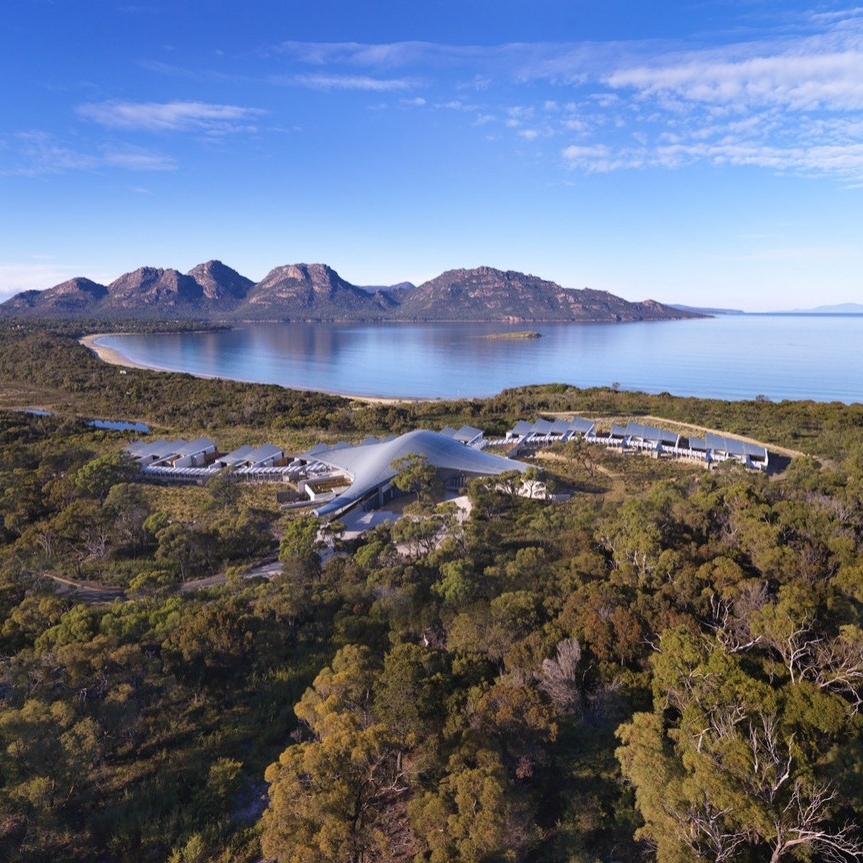 An aerial view over Saffire Freycinet and Freycinet National Park, with Wine lass Bay and the Hazards in the background © Saffire Freycinet