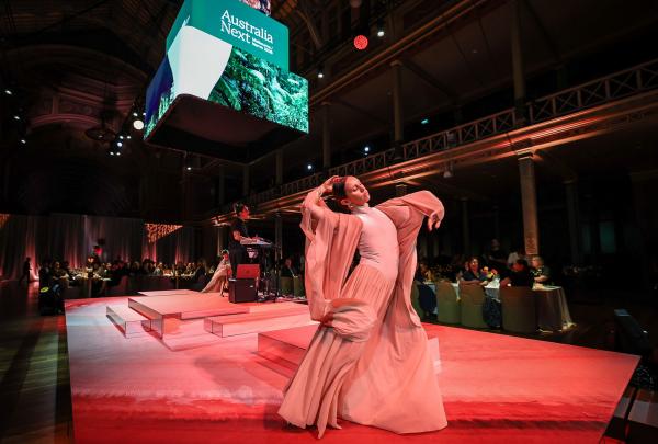 Performer on stage at the Australia Next 2025 dinner, Royal Exhibition Building, Victoria © Tourism Australia