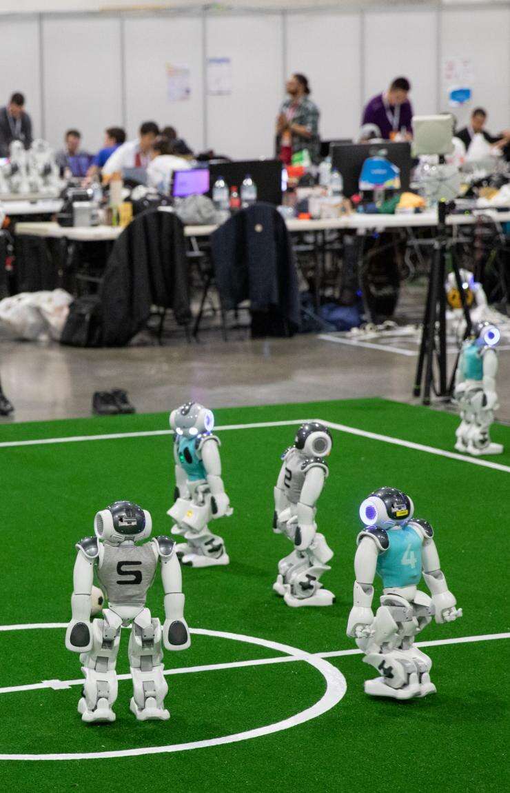 Robots playing on the field, RoboCup 2019, Sydney, New South Wales © RoboCup 2019