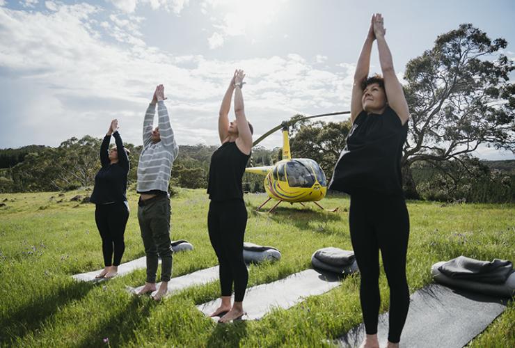 Yoga in the Barossa in front of the Barossa Helicopter © Barossa Helicopters