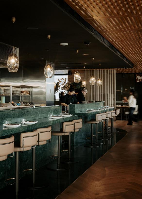 The green marble counter at Yakisan with team members working behind, Adelaide, South Australia © Yakisan