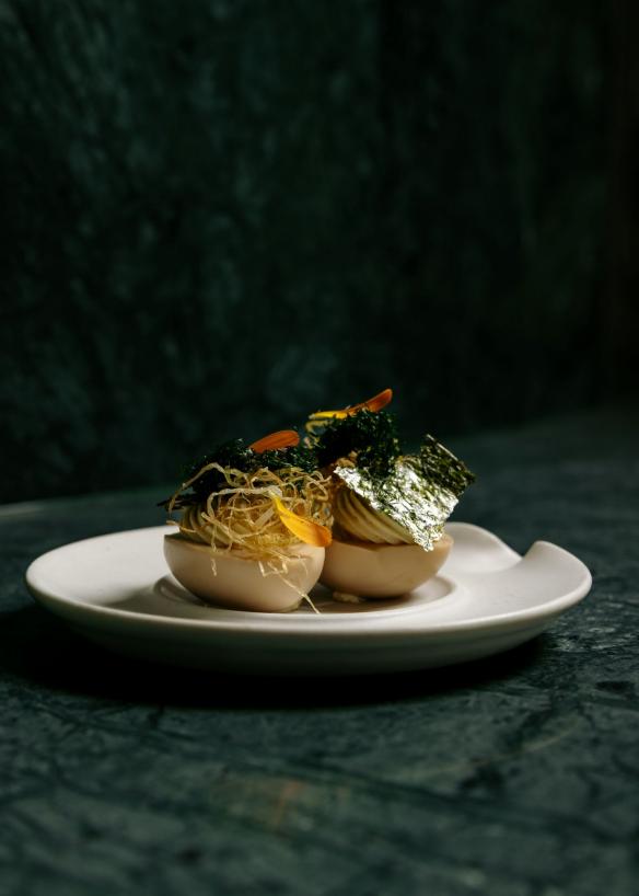 A plated dish of egg and seaweed sits on the green marble counter, Yakisan, Adelaide, South Australia © Yakisan