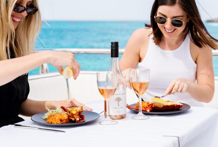 Two guests enjoying a seafood feast, Western Australia © Sea West