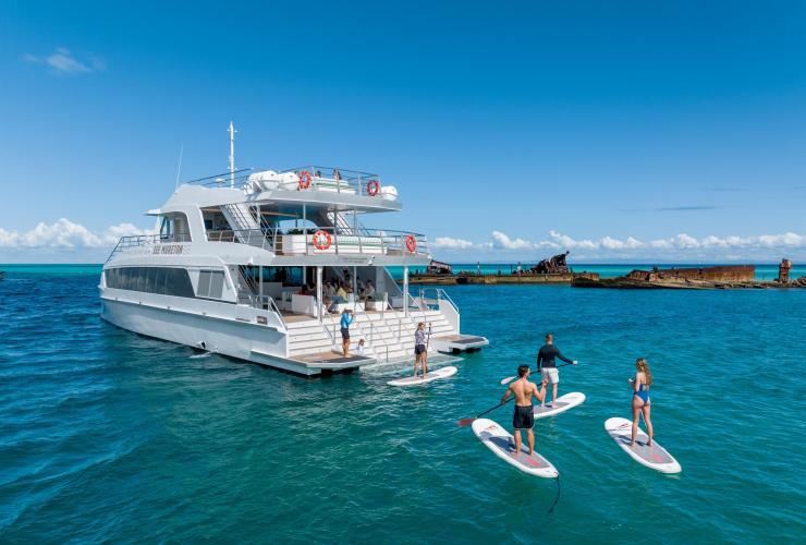 Paddle boarding off the Spirit of Mulgumpin at Tangalooma Wrecks, Queensland © See Morton