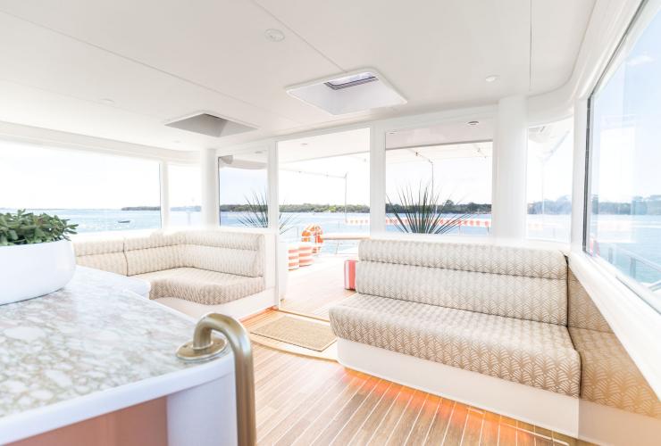 The upper deck of YOT VICE with bar and seating, Queensland © YOT Club