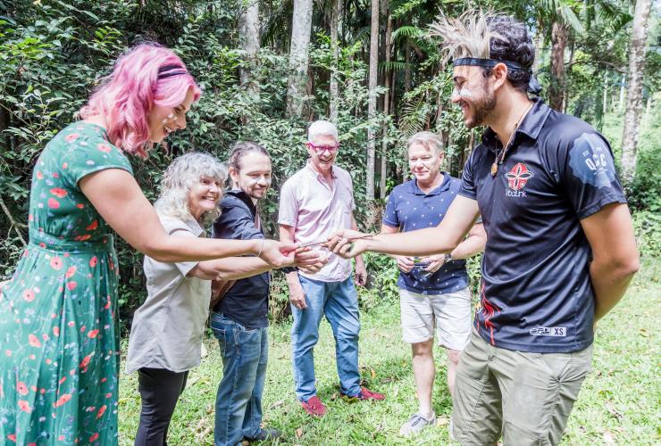 People discovering bushtucker on Dreaming Trails Tour at Tribalink, Sunshine Coast, Queensland © Mystical Mountain Tours