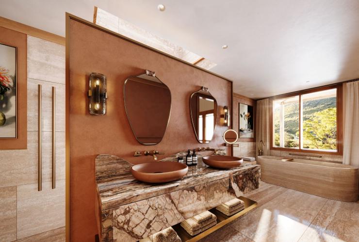 The expansive bathroom with marble, wood and brass finishes, Emirates Wolgan Valley, a Ritz-Carlton Lodge, Blue Mountains, New South Wales © Emirates Wolgan Valley, a Ritz-Carlton Lodge