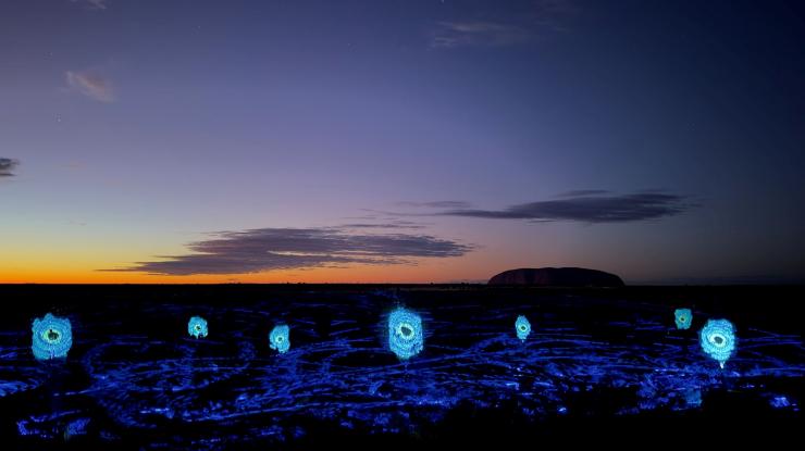 Lights colour the foreground of the desert floor during the Sunrise Journeys experience, Northern Territory © Ayers Rock Resort