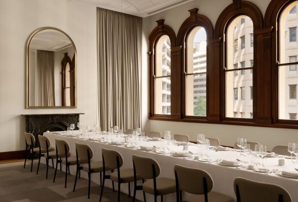 Heritage window frames and a long table set up for dining, The Lands by Capella, Bridge Street Sydney, New South Wales © Timothy Kaye