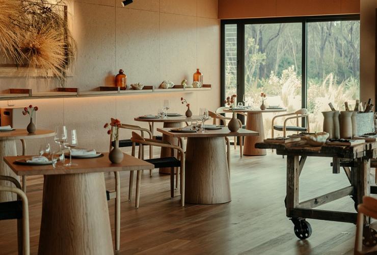 Dining room with woodfired heater and outside views, Barragunda, Mornington Peninsula, Victoria © Arianna Leggiero