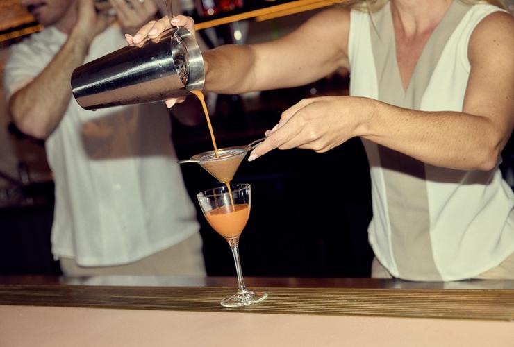 Pouring a cocktail at the bar at Haven, Mondrian, Gold Coast, Queensland © Content Lion