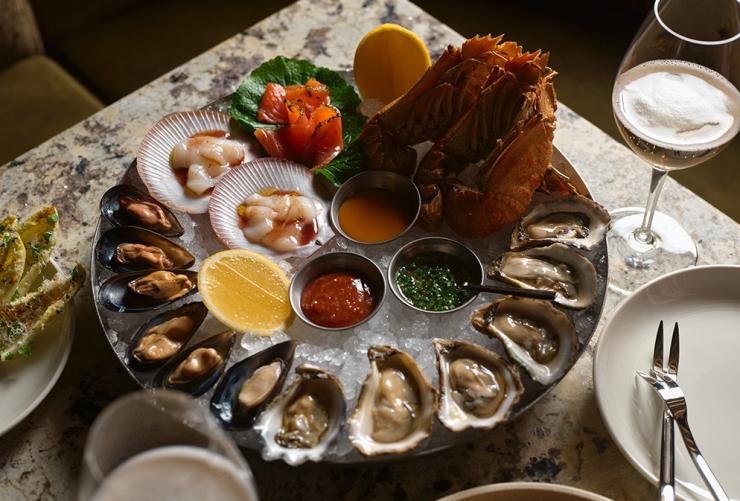 A seafood tower of fresh shellfish including oysters, mussels, Morton Bay Bugs and scallops, Sydney, New South Wales © Steven Woodburn