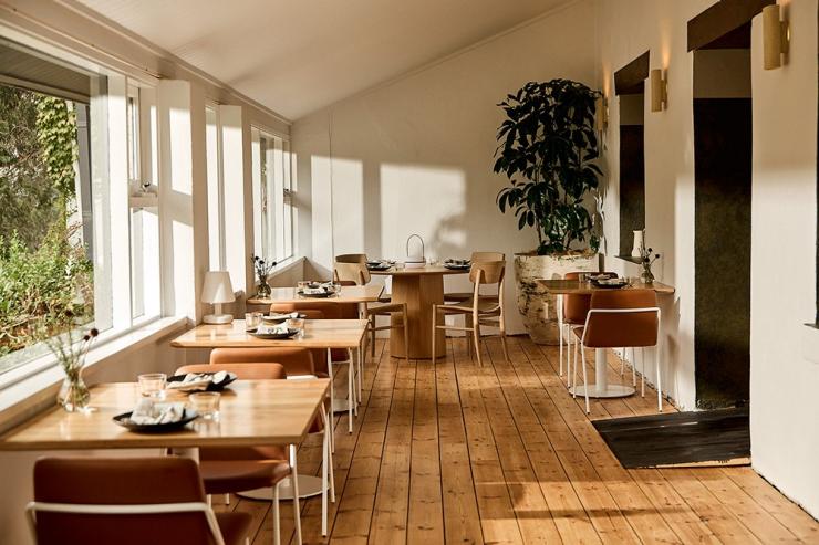 Dining area at Ondeen showing wooden tables and chairs in the Adelaide Hills, South Australia © Ondeen