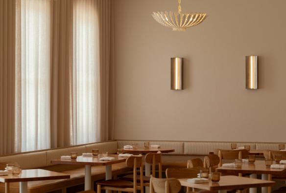 Floor to ceiling curtains and bespoke lighting adorn the neutral tones of Esmay © Esmay