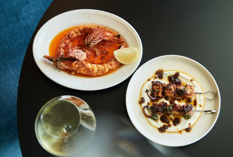 Seafood dishes plated on the table at Pearla&Co © Frances Andrijich