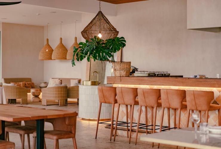 A corner area with soft seating and the bar © Peats Bite