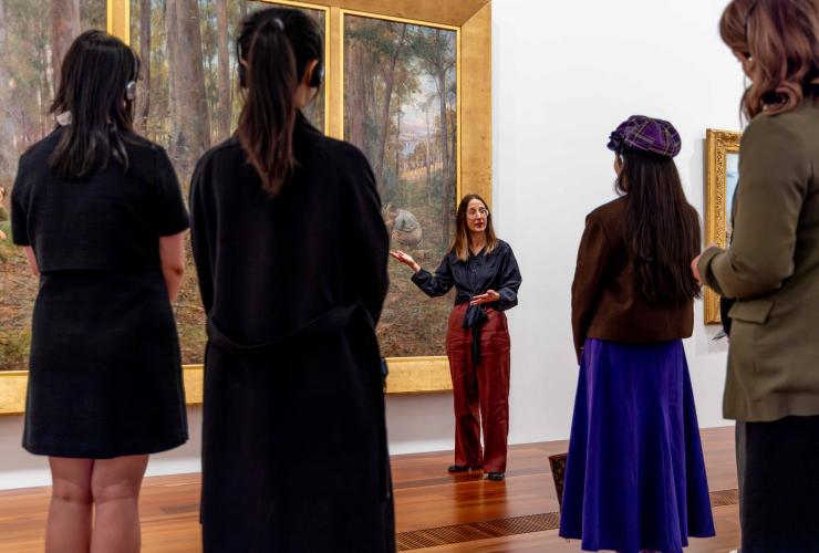 A group listens to the NGV explain historic Australian art at NGV Australia © National Gallery of Victoria