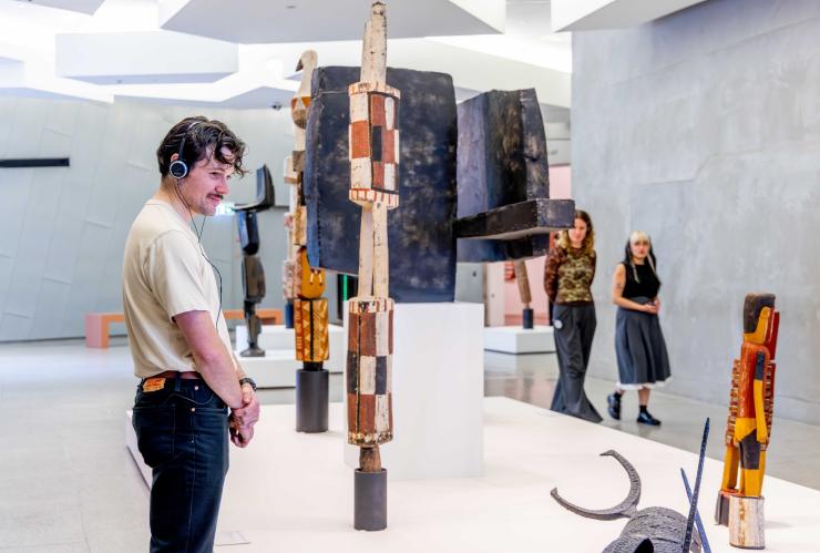 Group members explore First Nations sculpture at NGV Australia © National Gallery of Victoria