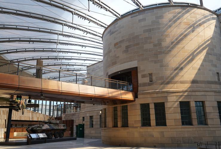 The bronze bridge and expansive glassed roof of the Atrium © Australian War Memorial