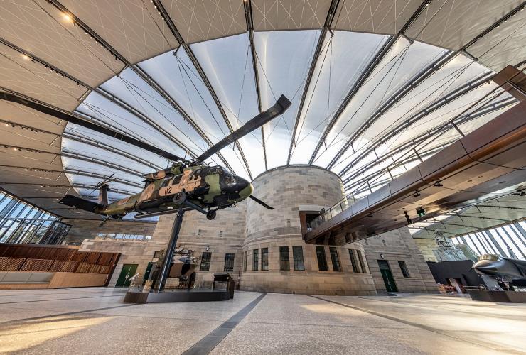 View of the Atrium showing the helicopter, fighter jet and tank under the expansive glazed roof © Australian War Memorial