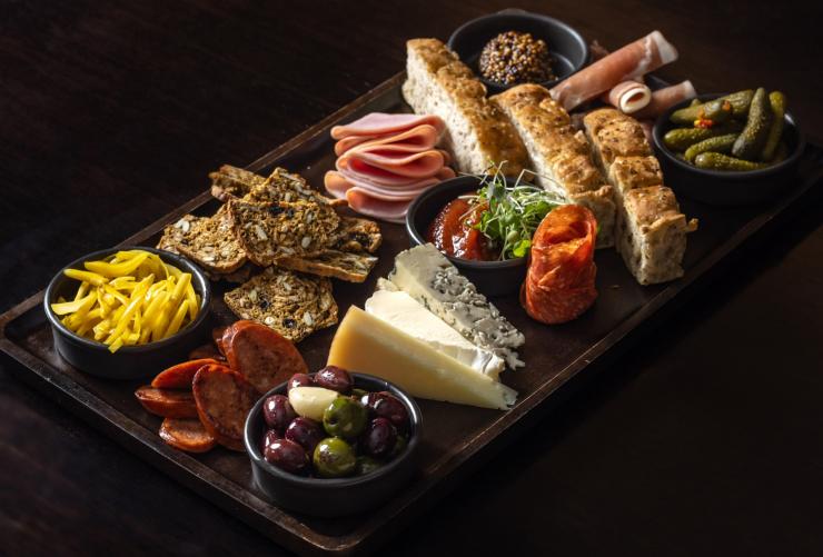 A bountiful charcuterie board on a table © MACq01