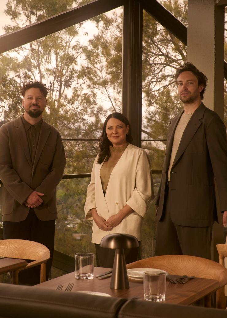 Restaurateur Tracy Keeley and the team at Lunetta standing with their backs to the native bush behind Lunetta. © Lillie Thompson