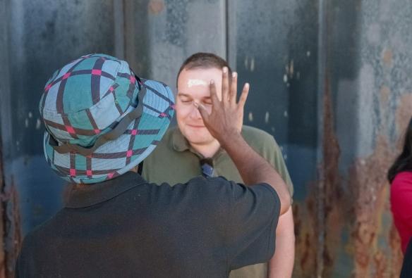 A guest receives an Indigenous facepainting. © Temptation Sailing