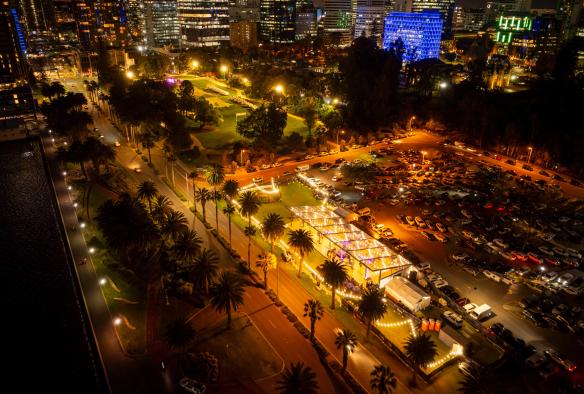 An aerial view of The Kingsman at night with the city skyline and and car park, set up for an event. © The Kingsman 