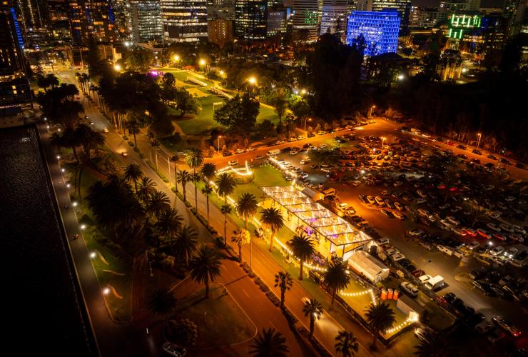 An aerial view of The Kingsman at night with the city skyline and and car park, set up for an event. © The Kingsman 