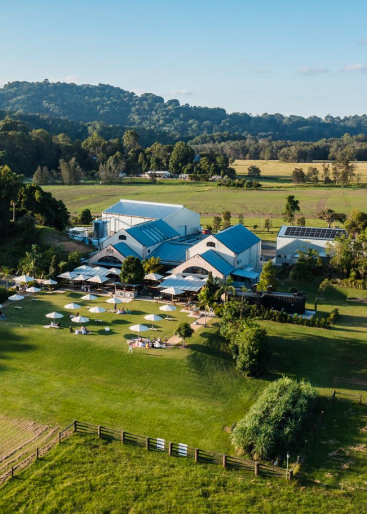 A view of the Husk Farm Distillery nestled among green hills, taken by drone. © Husk Farm Distillery