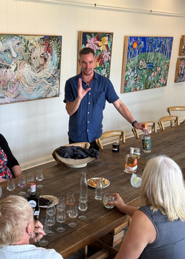 An Ink Gin Experience led by a Husk distiller, people sitting at the table for a gin tasting. © Husk Farm Distillery