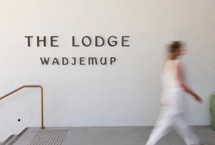 The whitewalled entrance and sign to Lodge Wadjemup. © Shot By Thom